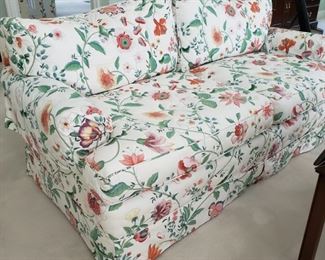 One of two upholstered settees
