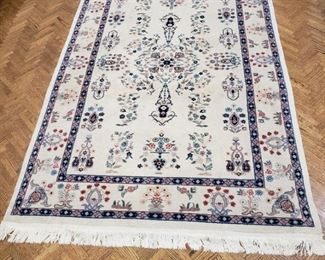 One of two handmade area rugs