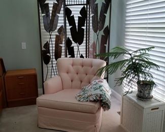 Upholstered armchair and metal screen