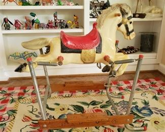 Vintage rocking horse on a needlepoint area rug