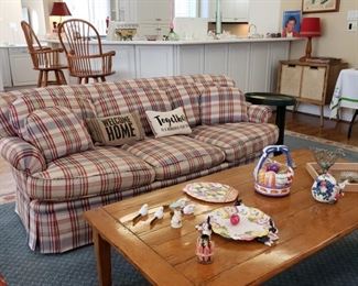 Pearson  Furniture Co. sofa and pine coffee table containing Easter decor some Fritz & Floyd and one Beatrice Potter rabbit