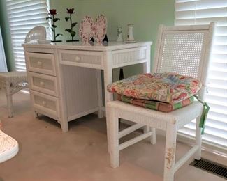White wicker desk, approx.. 46” wide x 19” deep x 30” tall and a wicker side chair
