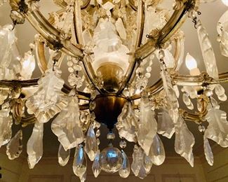 Detail: Brass and crystal chandelier. 