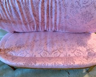 Detail: view of seat of settee with cushion up.