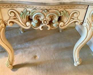 Detail: Scalloped-edge marble top table with painted carved wood base. 21.5"H x 26.5"D x 25.75'W