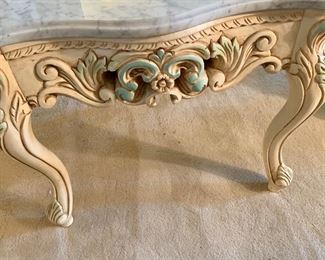 Detail: Scalloped-edge marble top table with painted carved wood base. 21.5"H x 26.5"D x 25.75'W