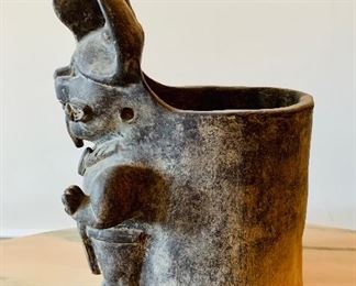 Side view: Mexican clay vessel.  11"H