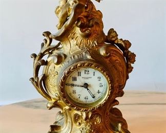 $80 New Haven Clock Co. clock with cherub ; 10" H x 5" W x 3" D