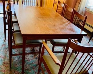 $1,500 MCM dining table made by J.L. Moller (made in Denmark). Two self-storing leaves. 71"L x 41"W x 28.5"H.  Fully extended table measures 117"L (each leaf is 23"L). [NOTE: table legs have been removed for easier moving]