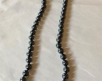 $15; Dark gray bead necklace with bow clasp.