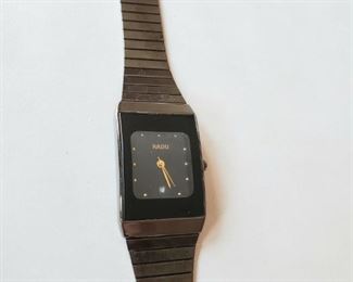 $95 Rado wristwatch ; 8" metal band; model number 601.2816.8 (needs battery)