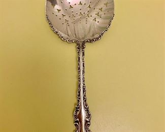 $75; Sterling slotted, serving spoon.  Whiting Co (NY) "Louis XV" Pattern circa 1900.  Monogrammed; Approx 72g. 
