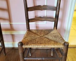 $75 each - Rush seat ladder back chairs; 1 of 2 available