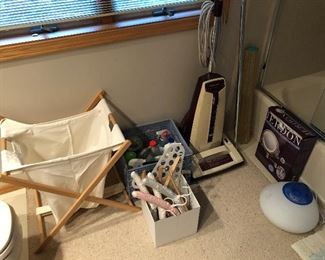 Folding hamper; Panasonic Jet-Flo vacuum cleaner.