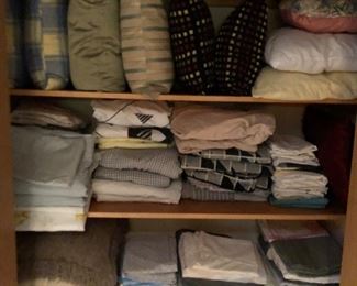 Lots of blankets, sheets, throw pillows and other linens and textiles.