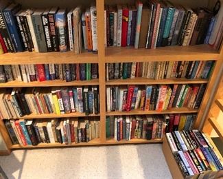 Large bookshelf packed with books (this photo shows only half of the shelf).