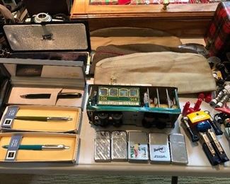 Vintage toys, lighters (including Zippos), toys, and more at smalls table near checkout.