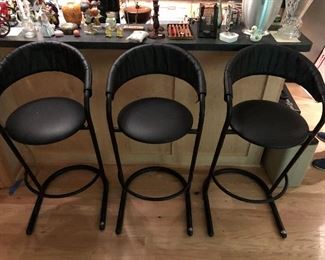 Three Amisco bar stools.