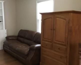 2 leather sofas and armoire.