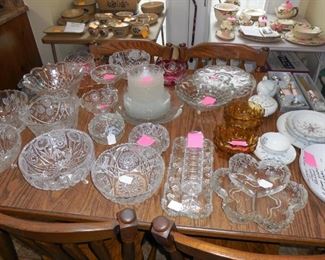 Variety of crystal bowls and platters.  Some Fostoria Americana.