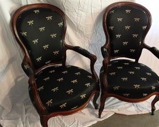 These very special chairs were held in the French Embassy in Paris and purchased for over two thousand dollars by the most recent owner.
They are in wonderful shape with beautiful upholstery, firm cushions, wheels on the front legs and an elegant curved wood frame.  