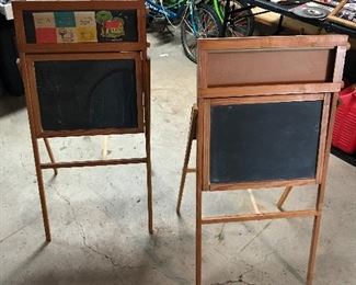Two children’s chalkboards on easels