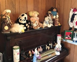 Stuffed animals and knickknacks on top of free piano