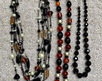 Lot 14:  Three beaded necklaces - black, brown and white: $15