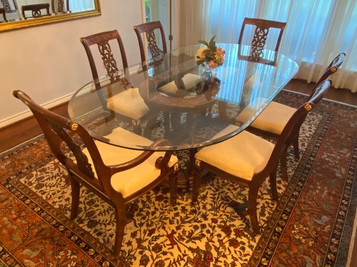 French Empire influenced style dining set made in China.  The owners purchased this  set in Abu Dhabi and shipped it back to Texas when they moved back.   The set has two arm chairs and six side chairs.  