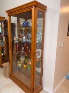 $275 One of two curio cabinet with sliding door and locks 