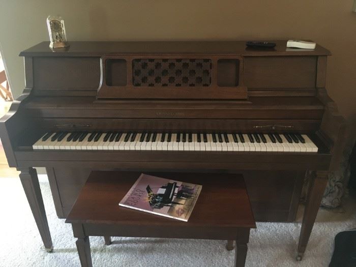 . . . a beautiful Grinnell's piano in walnut
