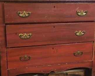 . . . one of two antique chests of drawers with original hardware