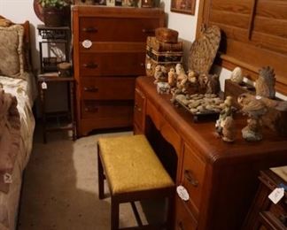 vanity, chest of drawers, small tables, wicker storage