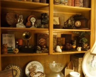 books,  decorative plates, clocks, owls
