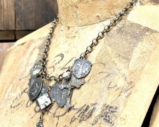 Gorgeous handmade necklace featuring a crucifix and several old Holy medals and some rhinestones. It is gorgeous and pictures do not do it justice. In excellent condition. Found in drawer of a dresser. $89