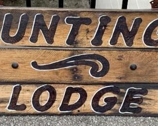 Large Hunting Lodge sign with metal motifs adhered to it. Heavy. 4 feet long. $40