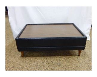 Nice Retro black leather-trimmed coffee table with a wood-look Formica top, the table is in good condition and measures 38'' x 26'' x 14'' tall      $35
