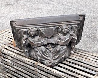 Large old Gothic Church Corbel, wall shelf with carved angels. Pretty spectacular. Painted chalkware. Easy to hang. Angles are holding celestial banner. Blackish brown in coloring. Chips from age but do not detract. Measures 21" x 10" x 15."  NOW $100 WAS $165