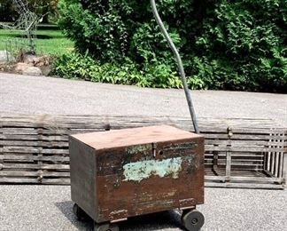 Heavy duty industrial rolling cart with original mint green paint and factory wheels. Top is wood and opens on the side. Handle is original, rolls well. A great piece of industrial decor. Heavy to pick up. $35 WAS $45