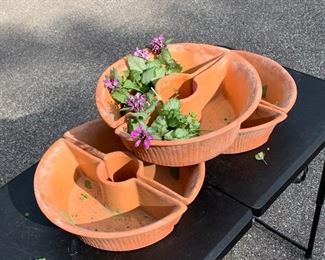 Terracotta garden planters. These are vintage. Each round planter is two pieces that fit together. There are three complete sets total. Each are $20. Great condition. Measure 12" diameter. 4" high