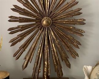 Very large Ecclesiastial gold painted wood starburst on base. Red tones and golds throughout. Stands 32" high. In great condition. Vintage. $225