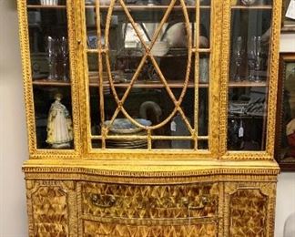 Gorgeous early 1900s china cabinet. Antique vinegar paint technique which is gorgeous. We have more photos of this piece on the ad.  In very good condition. Glass all intact. Has shelves inside. The grain created with the vinegar paint technique is gorgeous and somewhat resembles curly maple. Three drawers down the center, doors on side. All original. The bottom left door has a loose hinge that just needs to be tighted. Measures 70" x 42" x 13" - $95.00 WAS $125