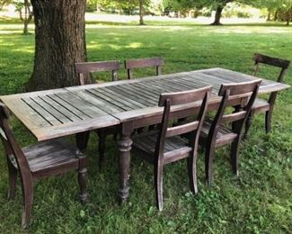 This a beautiful real teak dining set outdoor or indoor although we used it in the garden. It is perfect for either. And beautifully aged. Super sturdy with all the patina that naturally makes Teak a beautiful wood. Comes with 6 chairs. Table has a two leaves. Table measures 40"W x 60.5" long but if you put in the two leaves the table is 105.5" long. It comes with 6 chairs as shown. Everything is super solid. $1300 set