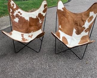 AMAZING! Real cowhide Mid Century Modern sling chairs, in excellent condition. WOW! Super comfortable, no stains, no smells. Cowhide sling covers detach from butterfly heavy metal frame. Pair for sale. Super cool and totally unique! $550 Pair