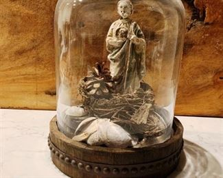 15" cloche includes base, glass dome and treasures inside which include an old chalkware distressed St. Jude statue, seashells, a real birdsnest and a small letter block. All for $59