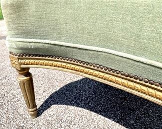 Close up of beading and legs of French upholstered bench from France. 