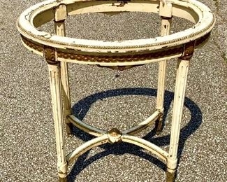 From France. Carved Late 1800s French table. Oval top. Would have had a marble top but that is now missing. Original gold paint and cream. Very sturdy. Measures 28" x 20" X 34" $85