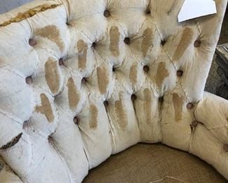 Close up of tufting on antique french chaise