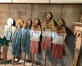 A complete set of amazing 1940s hand-painted choir figures for the holidays. Includes boy and girl choir figures on stakes and two candles with wreaths. You rarely find these in a full set $450 for set. Boys measure 42.5", girls measure 48.5" and candles measure 38.5". Add another foot to height when adding in the length of the stake. 