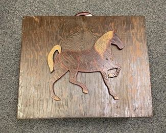 An outstanding Vintage Equestrian traveling tack box. 1920-1930s. Raised horse carved on woon front and back is a carved horseshoe. Next photo shows the interior of the box which opens to many compartments. Measures 18" x 9" x 15" closed and 31" x 18" opened.  $125